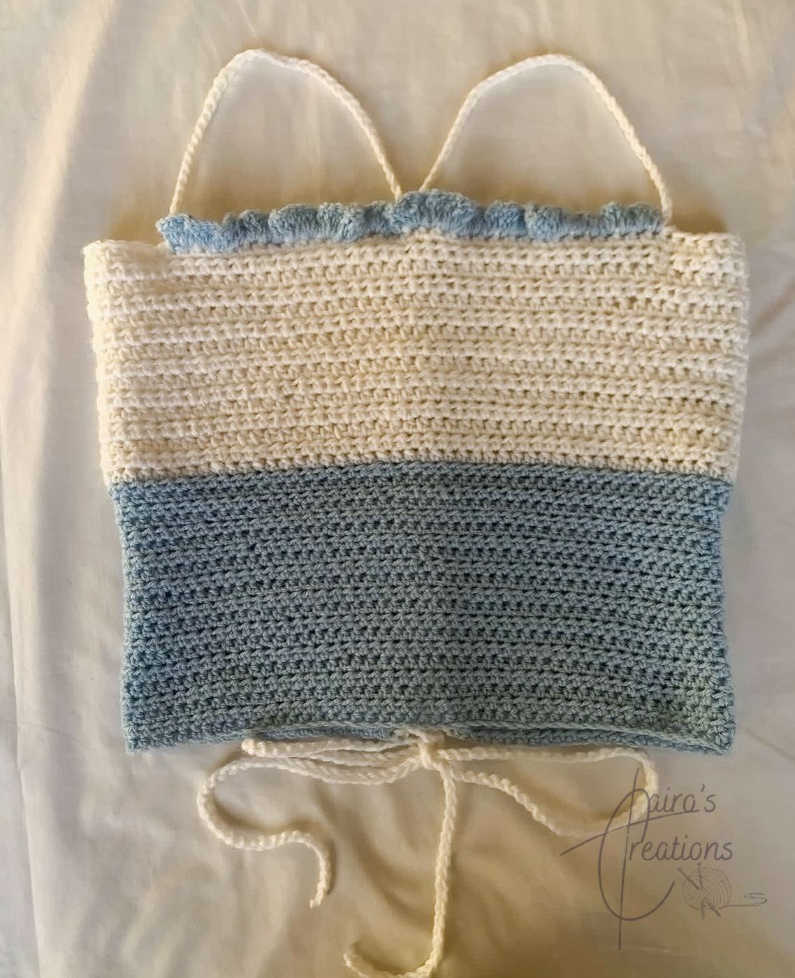 Blue and white crochet cami top with ruffle trim and tie back