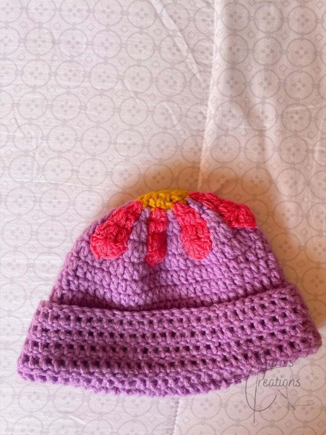 Purple crochet bucket hat with pink flower petals, retro beanies
